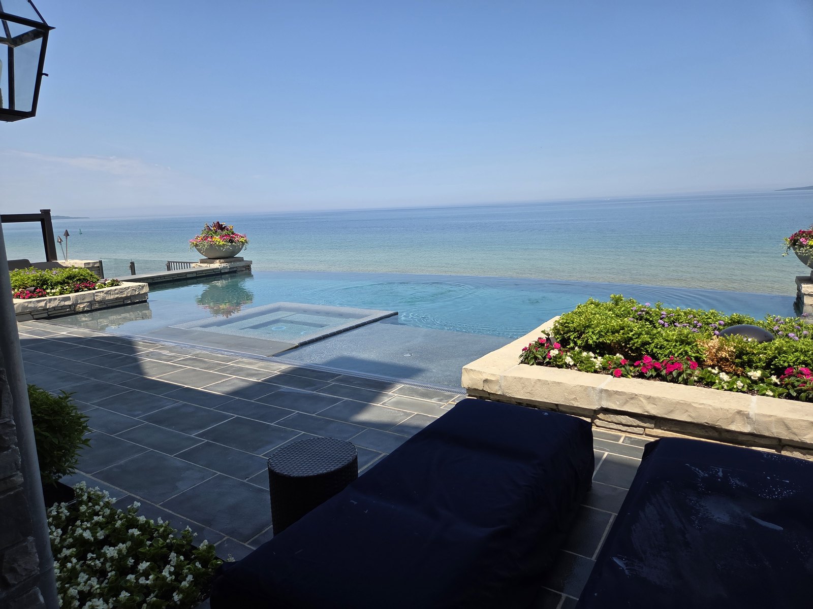 Luxury infinity pool overlooking water